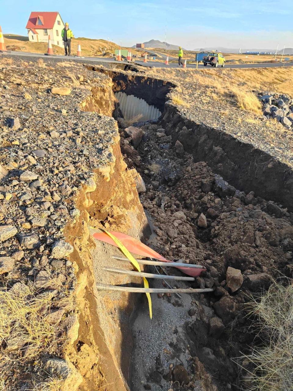 A view of cracks, emerged on a road due to volcanic activity, near Grindavik, Iceland 13 November 2023 (Reuters)