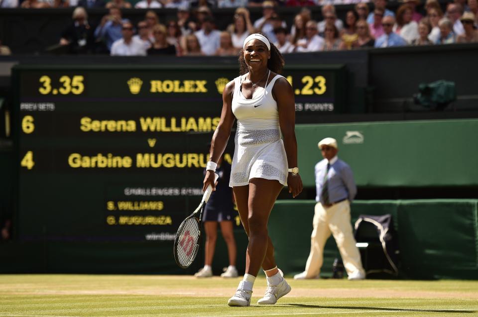 US player Serena Williams celebrates beating Spain's Garbine Muguruza in the women's singles final on day twelve of the 2015 Wimbledon Championships at The All England Tennis Club in Wimbledon, southwest London, on July 11, 2015. Williams won 6-4, 6-4.  RESTRICTED TO EDITORIAL USE  --  AFP PHOTO / LEON NEAL        (Photo credit should read LEON NEAL/AFP/Getty Images)