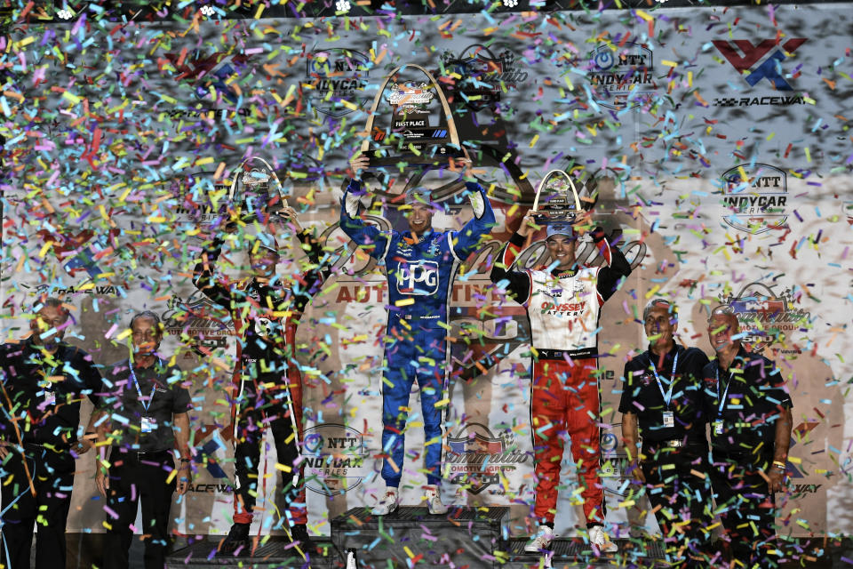 Third place winner Scott McLaughlin (3) second place winner David Malukas (18) and first place winner Josef Newgarden (2) pose for a picture with their trophies after an IndyCar auto race at World Wide Technology Raceway, Saturday, Aug. 20, 2022, in Madison, Ill. (AP Photo/Joe Puetz)