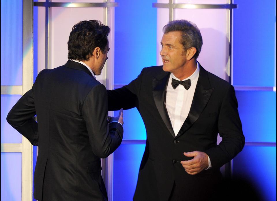 BEVERLY HILLS, CA - OCTOBER 14:  Actor Mel Gibson and honoree Robert Downey Jr. speak onstage during The 25th American Cinematheque Award Honoring Robert Downey Jr. held at The Beverly Hilton hotel on October 14, 2011 in Beverly Hills, California.  (Photo by Kevin Winter/Getty Images)