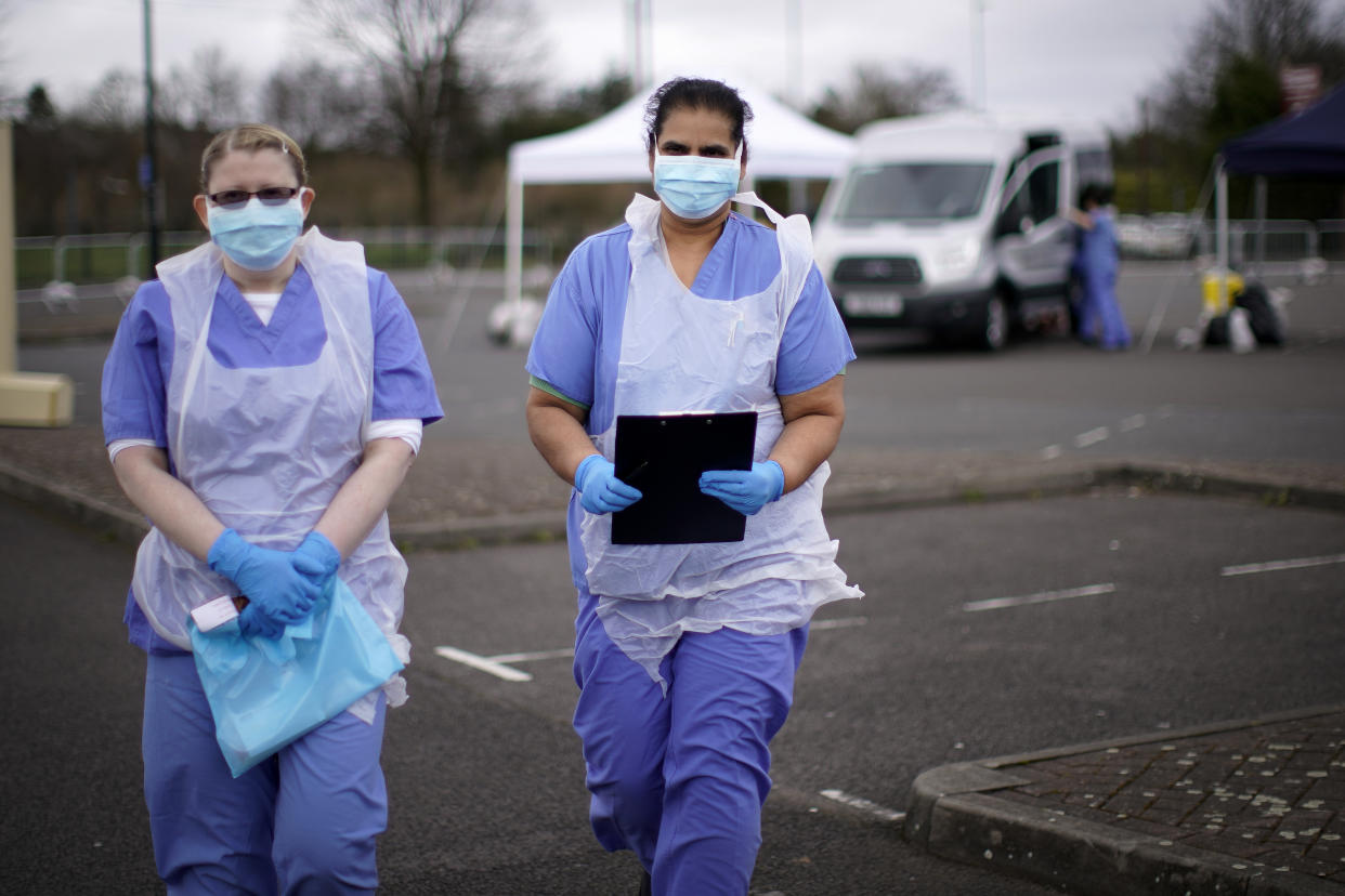 WOLVERHAMPTON, ENGLAND - MARCH 12: NHS nurses wait for the next patient at a drive through Coronavirus testing site in a car park on March 12, 2020 in Wolverhampton, England. The National Health Service facility has been set up in a car park to allow people with NHS referrals to be swabbed for Covid-19. (Photo by Christopher Furlong/Getty Images)