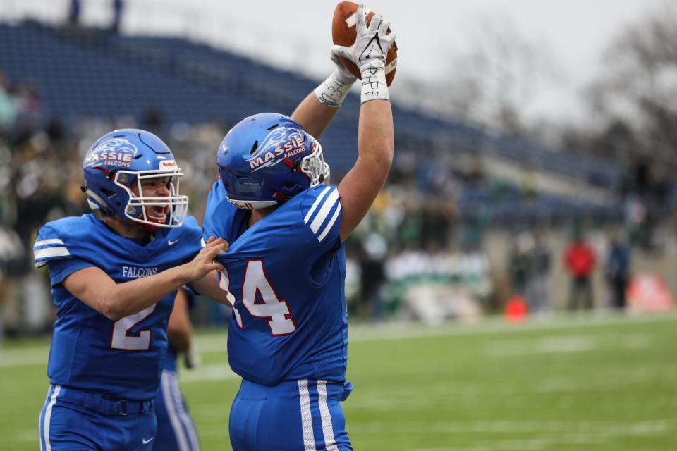 Falcons' Garrett Vance celebrates his touchdown during the OHSAA Division IV State Final game between the Clinton-Massie Falcons and the Ursuline Fighting Irish at the Tom Benson Hall of Fame stadium on Friday Dec. 3, 2021. The Clinton-Massie Falcons won the game with a final score of 29-28.