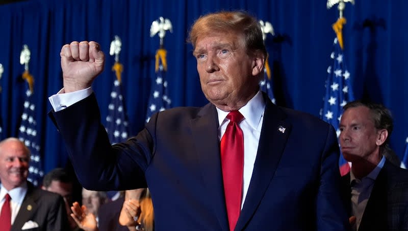 Republican presidential candidate former President Donald Trump reacts at a primary election night party at the South Carolina State Fairgrounds in Columbia, S.C., Saturday, Feb. 24, 2024.