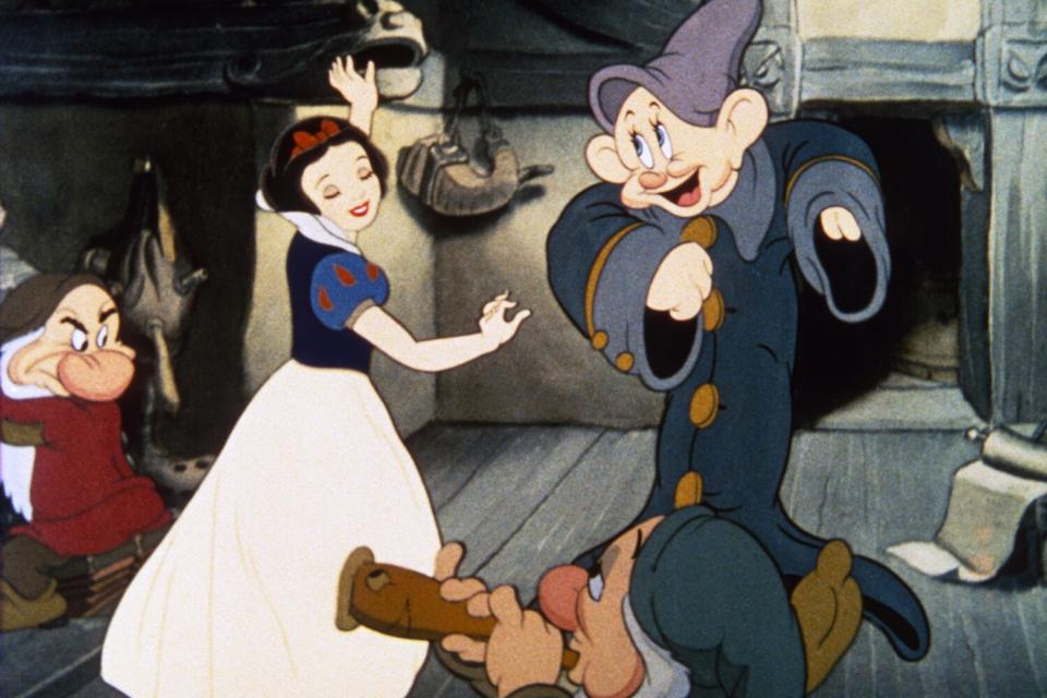 SNOW WHITE AND THE SEVEN DWARFS, clockwise from left: Grumpy (Pinto Colvig), Snow White (voice: Adriana Caselotti), Dopey (voice: Eddie Collins), Sleepy (voice: Pinto Colvig), 1937.