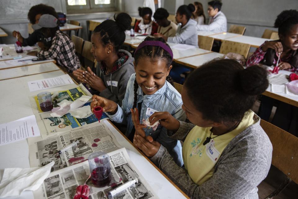 Girls learn about menstrual cups at a Noble Cup workshop