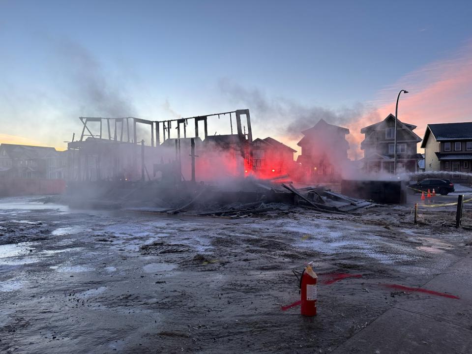 Fire crews were called to a fire inside a home under construction in west Edmonton Wednesday morning. Police say the case is believed to be linked to a known extortion scheme in the city.