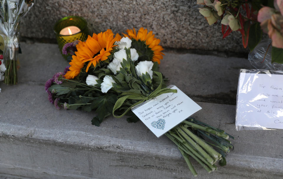 Floral tributes for Gaia Pope are left at the King Alfred Monument on the seafront in Swanage (PA Images)