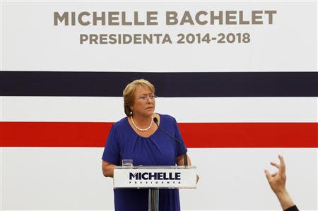 Chile's President-elect Michelle Bachelet listens to a question during a news conference at her headquarters in Santiago, December 16, 2013. REUTERS/Ivan Alvarado