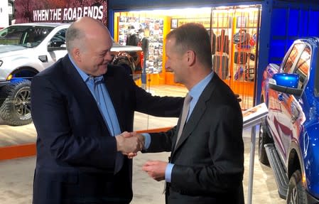 FILE PHOTO: The President and CEO of Ford Motor Company Hackett shakes hands with Volkswagen CEO Diess at the North American International Auto Show in Detroit