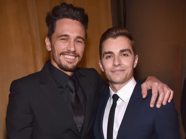 <p>Kevin Mazur/Getty</p> James Franco (L) and Dave Franco attend the National Board of Review Annual Awards Gala