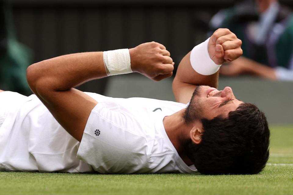 The winning moment: Carlos Alcaraz collapses in celebration after Sunday’s epic showdown (Getty Images)