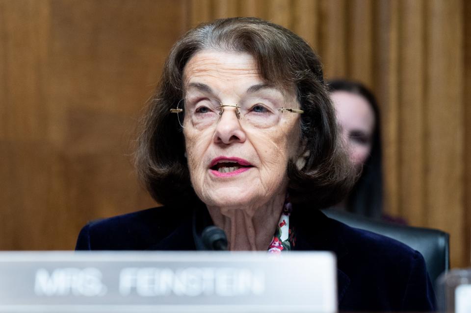 Sen. Dianne Feinstein at the microphone.