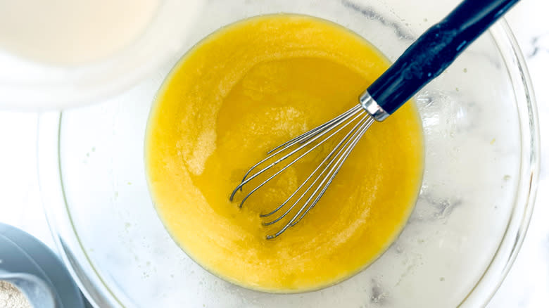 whisking wet batter in bowl