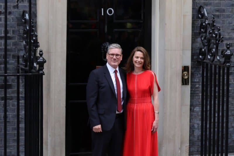 Newly appointed British Prime Minister Sir Keir Starmer (L) and his wife Victoria pose on the steps outside No.10 Downing Street in London on Friday. Photo by Hugo Philpott/UPI