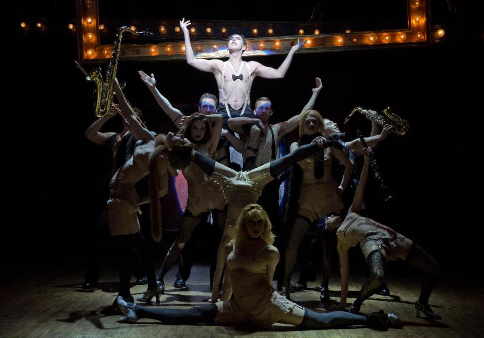 This undated image released by Polk & Co. shows Alan Cumming, background center, during a performance in "Cabaret," at Studio 54 in New York. (AP Photo/Polk & Co., Joan Marcus)