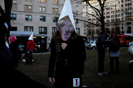 Anti-Trump demonstrators organized by RefuseFascism.org gather at McPherson Square in Washington January 18, 2017. REUTERS/James Lawler Duggan