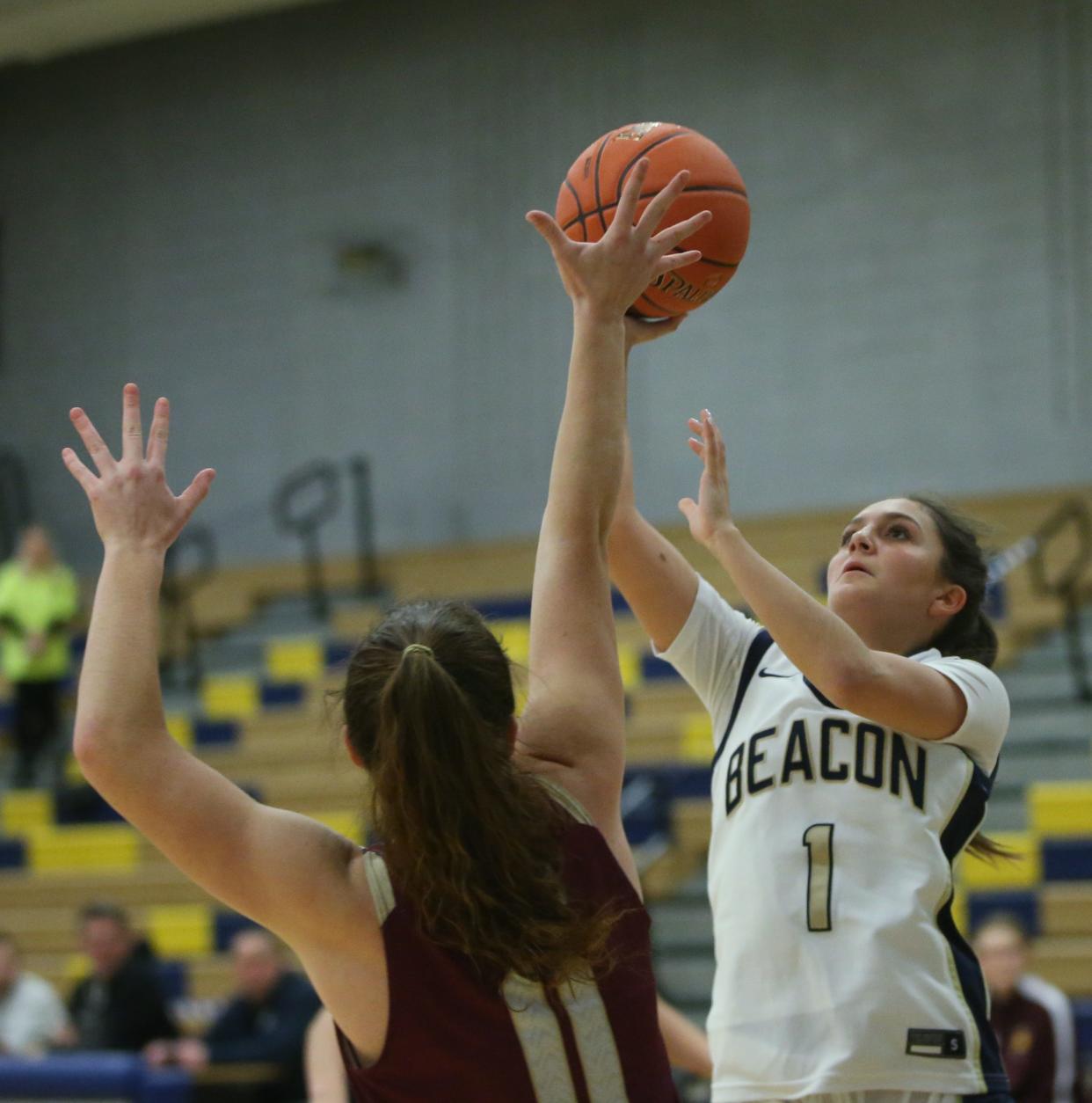 Beacon's Reilly Landisi goes for a layup against O'Neill's Daisy West during a game on January 22, 2024.