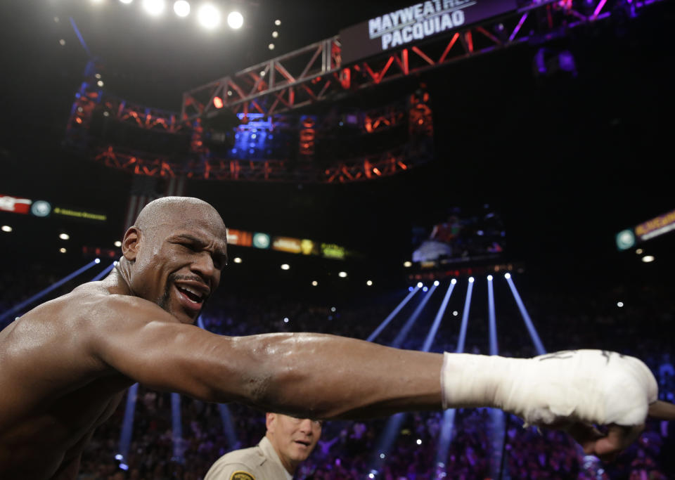 Floyd Mayweather Jr., reacts after the welterweight title fight against  Manny Pacquiao, from the Philippines, on Saturday, May 2, 2015 in Las Vegas. (AP Photo/Isaac Brekken)