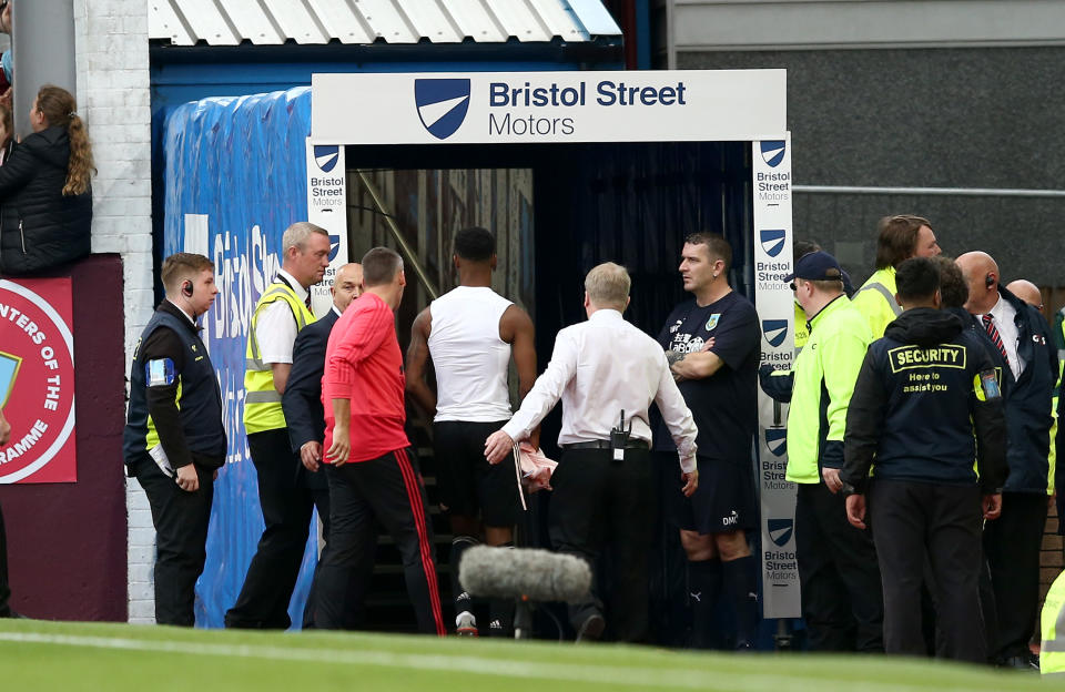 Rashford heads down the tunnel after Moss brandished the red card