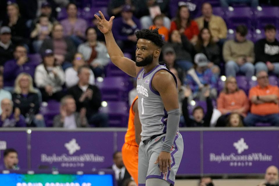 TCU guard Mike Miles Jr. (1) celebrates sinking a 3-point shot in the first half Saturday.