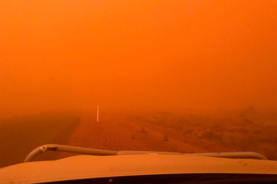 Dust storm in the outback: The dust storm left an eerie red haze it its wake. 