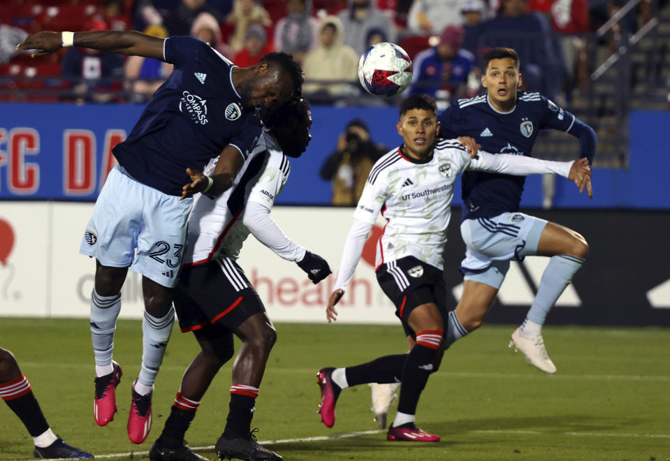 Sporting Kansas City forward Willy Agada (23) tries to score with a header against Dallas in the second half of an MLS soccer match, Saturday, March 18, 2023, in Frisco, Texas. (AP Photo/Richard W. Rodriguez)