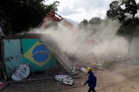 <p>Destruction and rebuilding in Vila Autodromo for the Rio Olympics</p><p>The house of Carlos Augusto and Sandra Regina (not pictured) who have lived in Vila Autodromo slum for 20 years with their children, is demolished after the family moved to one of the twenty houses built for the residents who refused to leave the community, in Rio de Janeiro, Brazil, August 2, 2016. (REUTERS/Ricardo Moraes)</p>