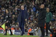 Brugge's head coach Philippe Clement, left, and Manchester City's head coach Pep Guardiola gesture from the touchline during the Champions League Group A soccer match between Manchester City and Club Brugge at the Etihad stadium, in Manchester, England, Wednesday Nov. 3, 2021. (AP Photo/Rui Vieira)