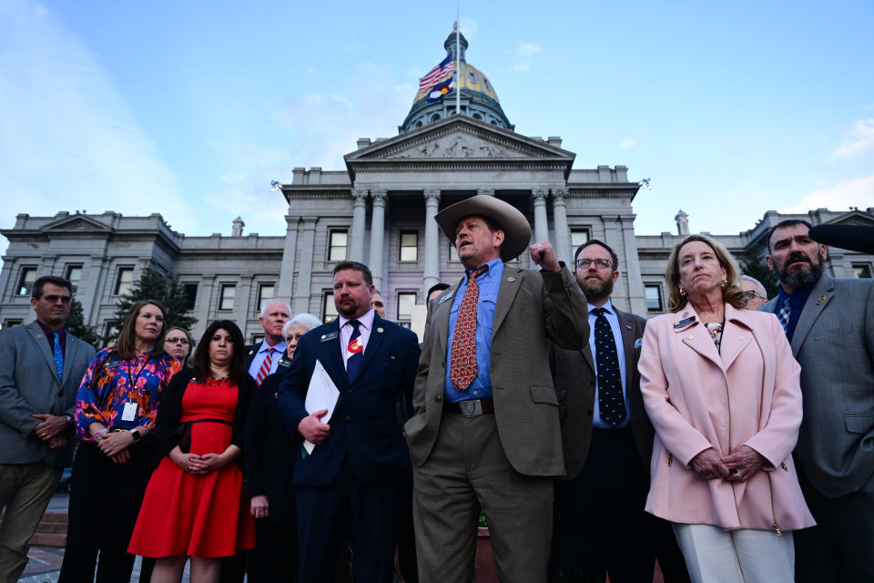 Colorado House Minority Leader Mike Lynch, state Rep. Lisa Frizell and other Republican lawmakers outside the Capitol building in Denver.
