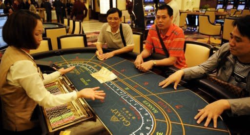 Punters play in the casino of the Galaxy Macau hotel and resort in 2011. Construction for the second phase of Galaxy Macau has started and would expand the size of the property to 1.0 million square metres (10.8 million square feet)