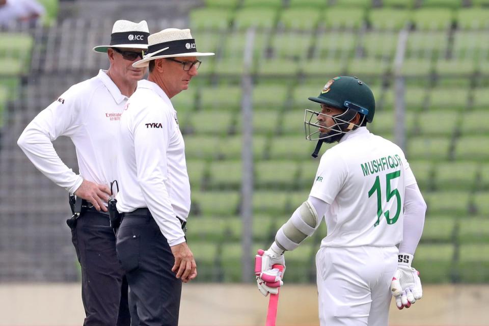 Mushfiqur Rahim talks to the umpires after his dismissal against New Zealand (AP)