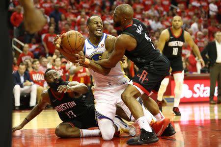 May 14, 2018; Houston, TX, USA; Golden State Warriors forward Andre Iguodala (9) battles Houston Rockets guard James Harden (13) and guard Chris Paul (3) for a loose ball during the fourth quarter in game one of the Western conference finals of the 2018 NBA Playoffs at Toyota Center. Mandatory Credit: Troy Taormina-USA TODAY Sports