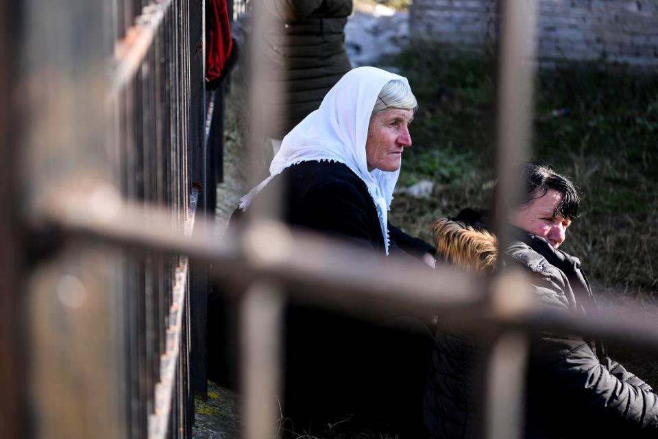 Relatives of people living at a collapsed building sit in Thumane, northwest of capital Tirana, after an earthquake hit Albania, on November 26, 2019. (Photo: Armend NimaniI/AFP via Getty Images)