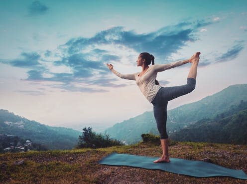   <span class="attribution"><a class="link " href="https://www.shutterstock.com/image-photo/woman-doing-yoga-asana-natarajasana-lord-552071470" rel="nofollow noopener" target="_blank" data-ylk="slk:Shutterstock/Dmitry Rukhlenko;elm:context_link;itc:0;sec:content-canvas">Shutterstock/Dmitry Rukhlenko</a></span>