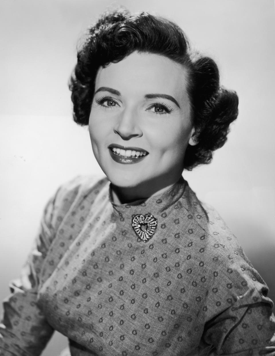 Betty in a printed high-neck dress