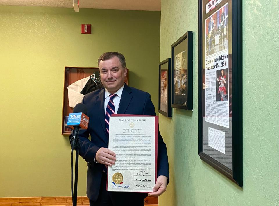 State Representative Ron Gant holds Friday morning's proclamation honoring the Carl Perkins Center's 40th anniversary.