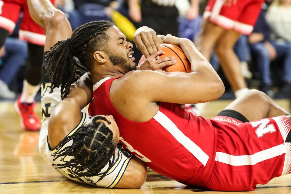 Michigan guard Kobe Bufkin and Nebraska forward Derrick Walker battle for the loose ball during the first half on Wednesday, Feb. 8, 2023, at Crisler Center.