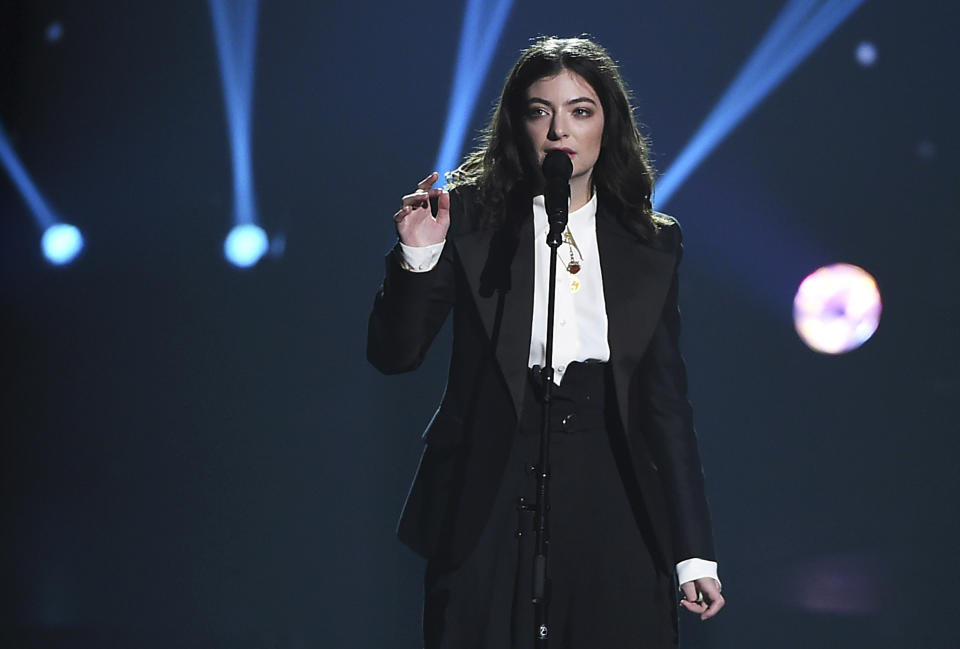 FILE - Lorde performs at the MusiCares Person of the Year tribute honoring Fleetwood Mac on Jan. 26, 2018, in New York. Lorde is ditching the disc for her new third studio album "Solar Power," out on Friday, Aug. 13, 2021. Instead of CDs, fans can buy a plastic-free music box that contains a download card and other extras. (Photo by Evan Agostini/Invision/AP, File)