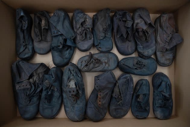 Shoes that belonged to child victims of the former Nazi German death camp Auschwitz-Birkenau lie in a box at the conservation laboratory on the grounds of the camp in Oswiecim, Poland.