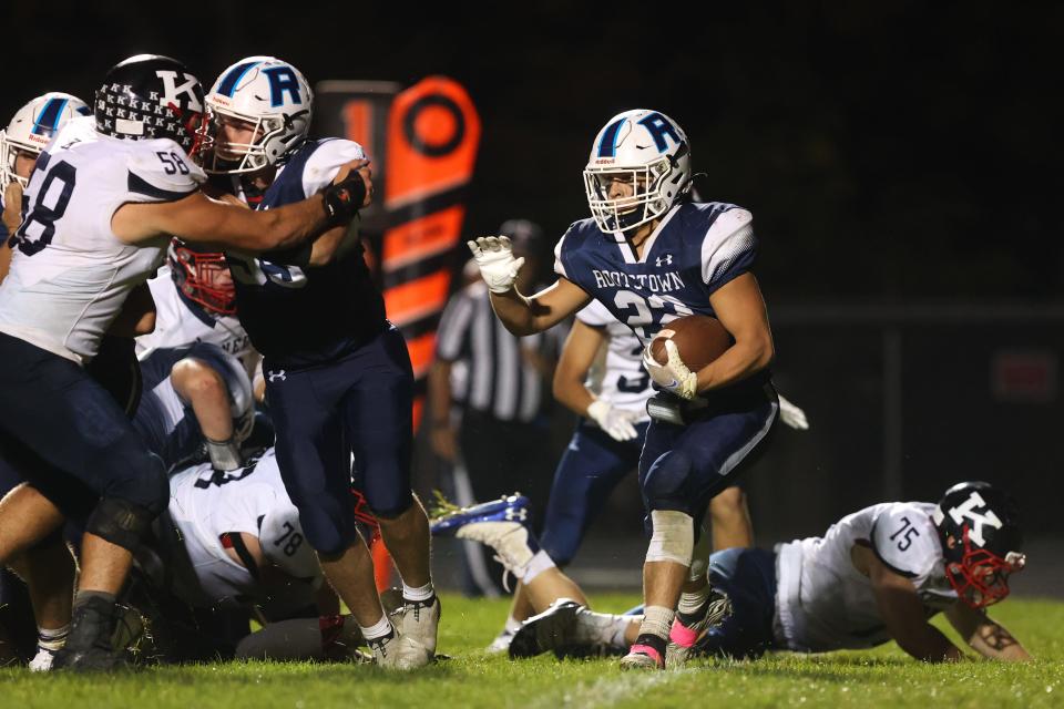 Rootstown junior Cody Coontz looks for a running lane with the ball. The Rootstown Rovers hosted the Warren JFK Catholic Eagles Friday night at Robert C. Dunn Field. The Rovers fell to the Eagles 48-7.