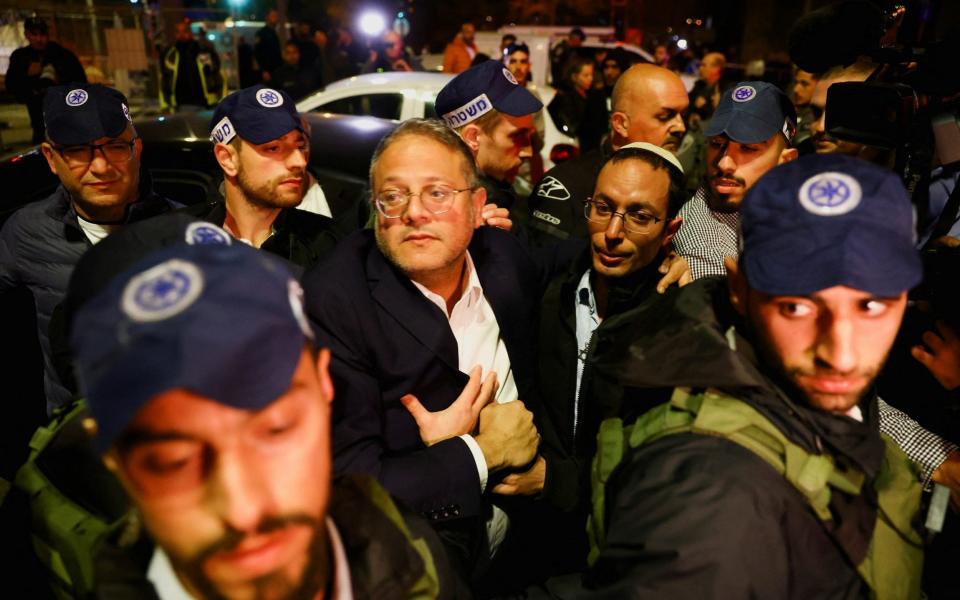 Israel's Minister of National Security Itamar Ben-Gvir meets with Israeli forces near the scene of a shooting attack - RONEN ZVULUN