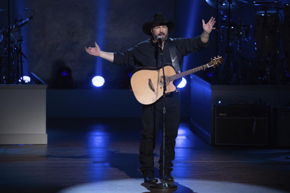 FILE - In this March 4, 2020, file photo, Garth Brooks performs on stage during the 2020 Gershwin Prize Honoree's Tribute Concert at the DAR Constitution Hall in Washington. (Photo by Brent N. Clarke/Invision/AP)