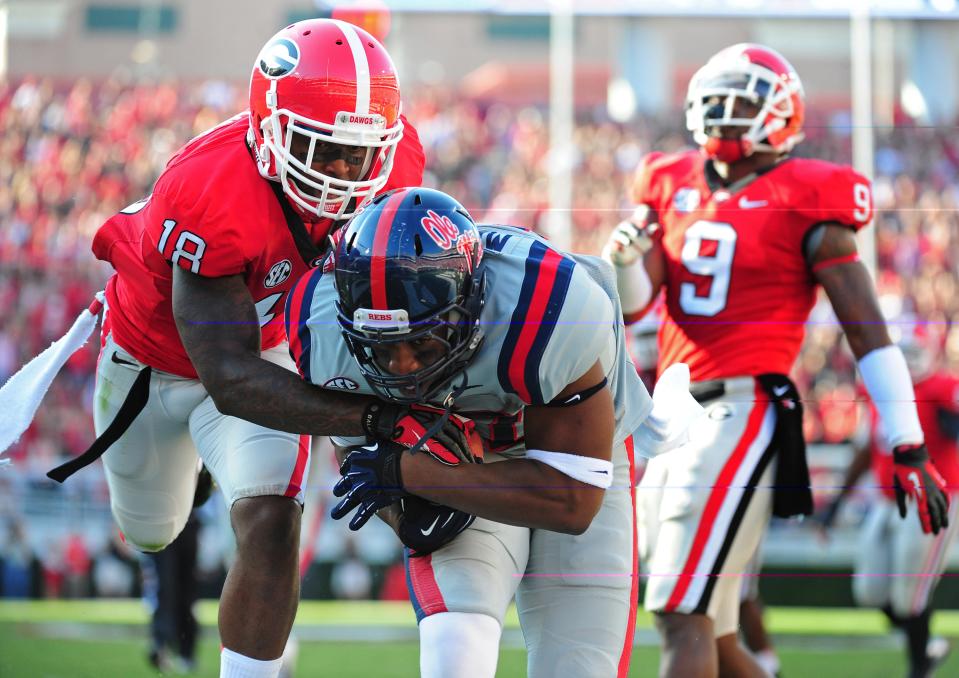 Jamal Mosley #17 of the Ole Miss Rebels scores a touchdown against Bacarri Rambo #18 of the Georgia Bulldogs at Sanford Stadium on November 3, 2012 in Athens, Georgia. (Photo by Scott Cunningham/Getty Images)