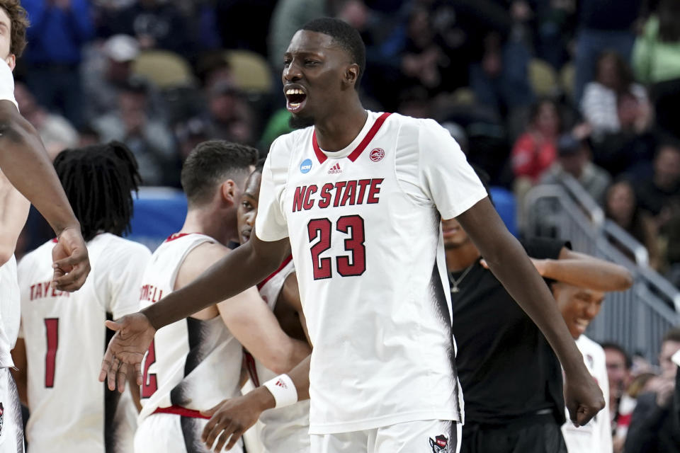 North Carolina State's Mohamed Diarra (23) celebrates after defeating Oakland in a college basketball game in the second round of the NCAA men's tournament Saturday, March 23, 2024, in Pittsburgh. (AP Photo/Matt Freed)