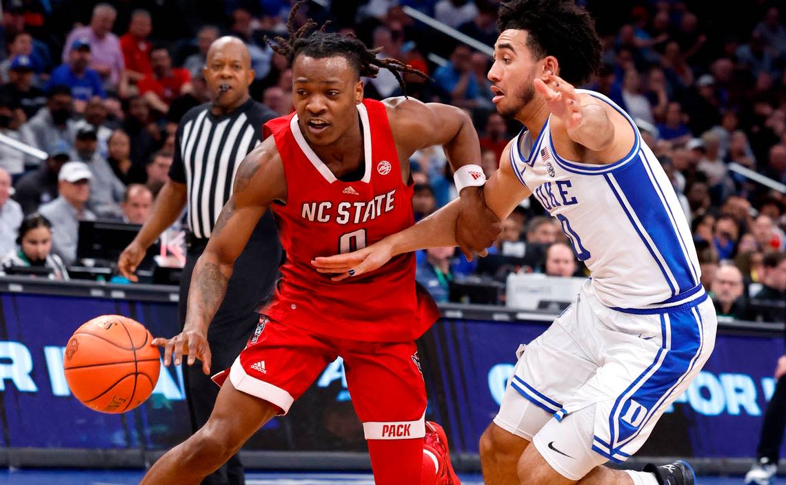 N.C. State’s DJ Horne (0) drives by Duke’s Jared McCain (0) during the second half of N.C. State’s 74-69 victory over Duke in the quarterfinal round of the 2024 ACC Men’s Basketball Tournament at Capital One Arena in Washington, D.C., Thursday, March 14, 2024.