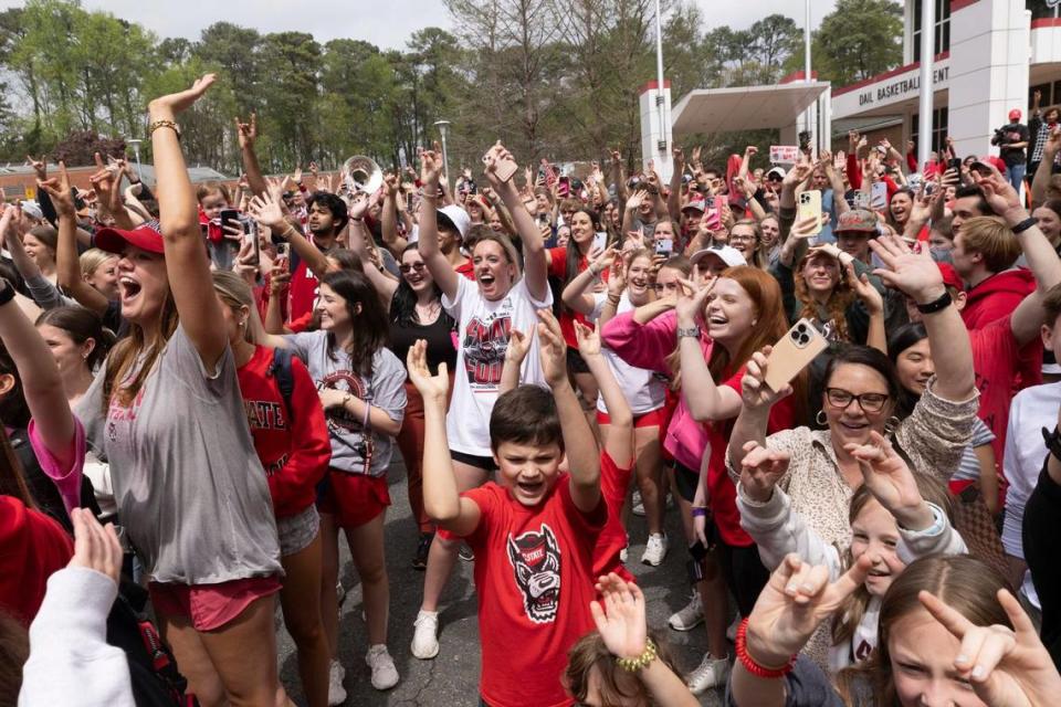 NC.State fans cheer as a bus carrying the men’s basketball team departs campus Wednesday, April 3, 2024. The team is headed to the Final Four for the first time since 1983. Travis Long/tlong@newsobserver.com