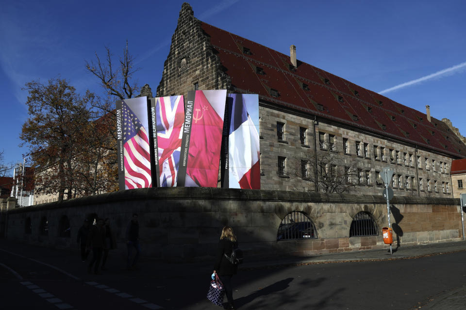 Flags of Great Britan, the United States, France an Russia stand in front of the palace of justice in Nuremberg, Germany, Wednesday, Nov. 18, 2020. Germany marks the 75th anniversary of the landmark Nuremberg trials of several Nazi leaders and in what is now seen as the birthplace of a new era of international law on Friday, Nov. 20, 2020. (AP Photo/Matthias Schrader)