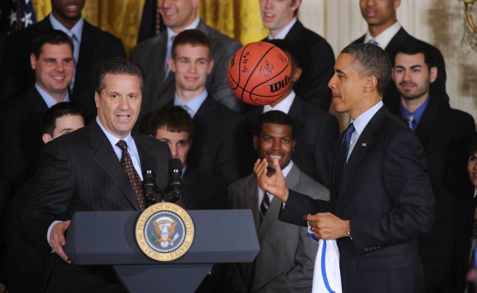 President Barack Obama, right, meets with Kentucky coach John Calipari and the Wildcats to celebrate the 2012 NCAA championship in the East Room of the White House on May 4, 2012.