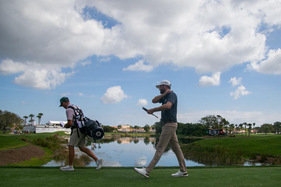 Chris Kirk walks alongside his caddie, Michael Cromie, on his way to the 15th tee during the second round of the Honda Classic at PGA National Resort & Spa on Friday, February 24, 2023, in Palm Beach Gardens, FL.