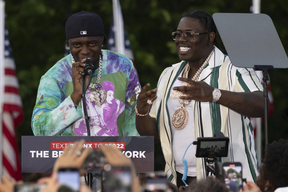 Rappers Sheff G, right, also known as Michael Williams, and Sleepy Hallow, also known as Tegan Chambers, join the Republican presidential candidate former President Donald Trump during a campaign rally in the south Bronx, Thursday, May. 23, 2024, in New York. (AP Photo/Yuki Iwamura)